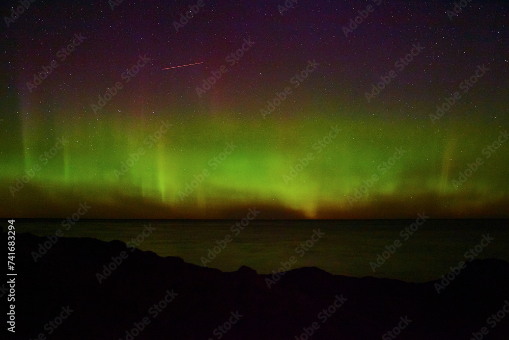 Aurora Borealis Over Calm Michigan Waters - Coastal Night Sky