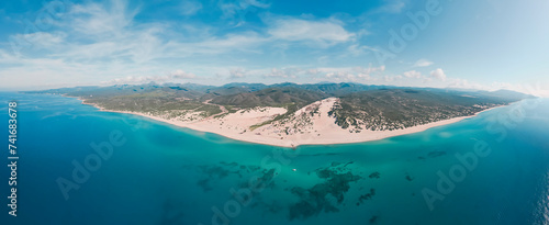 Aerial panoramic view of sand dunes along the coastline at Piscinas Beach, Arbus, Sardinia, Italy. photo
