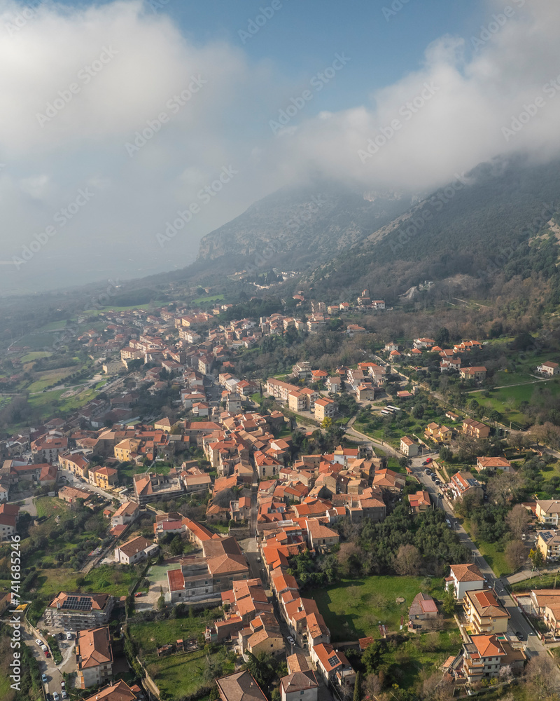 Aerial view of Capaccio, a small town along the mountains with low clouds, Paestum, Salerno, Campania, italy. Aerial view of Capaccio, a small town along the mountains with low clouds, Paestum, Salerno, Campania, italy.