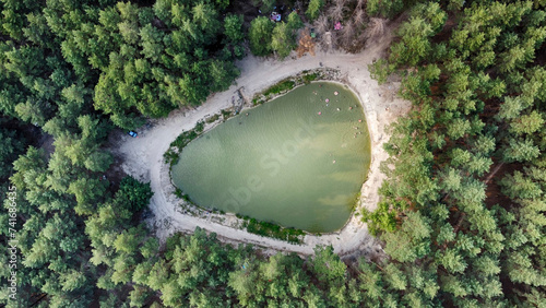 Aerial drone view of the small forest pond near Merefa, Kharkiv Oblast, Ukraine. photo