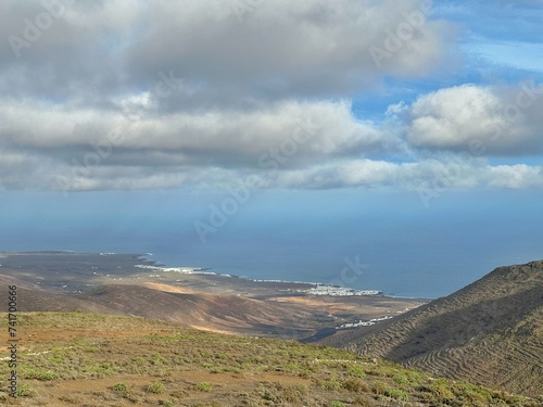 Distant aerial view of coastal town of Arrieta, Lanzarote, Canary Islands, Spain photo