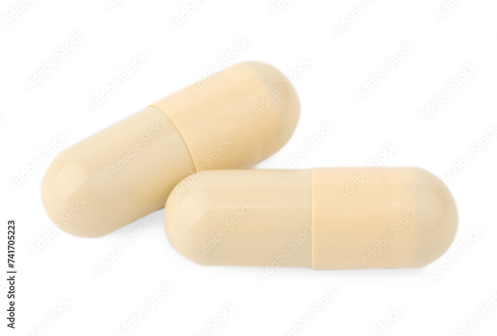 Vitamin capsules isolated on white, top view