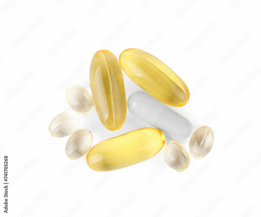 Different vitamin capsules isolated on white, top view Different vitamin capsules isolated on white, top view