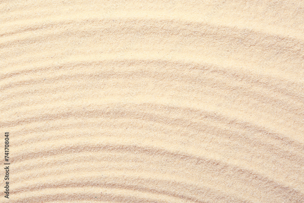 Zen rock garden. Wave pattern on beige sand, top view Zen rock garden. Wave pattern on beige sand, top view