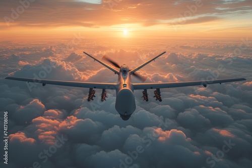 Sunset soar: military drone glides over cloud-wrapped terrain
