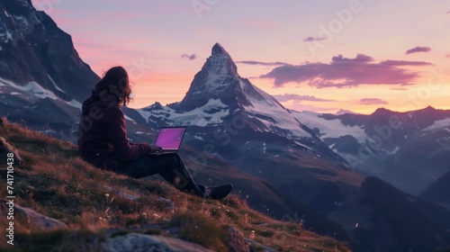 digital nomad concept remote work rerson with laptop against mountain sunrise, lifestyle solitude and scenery © pier