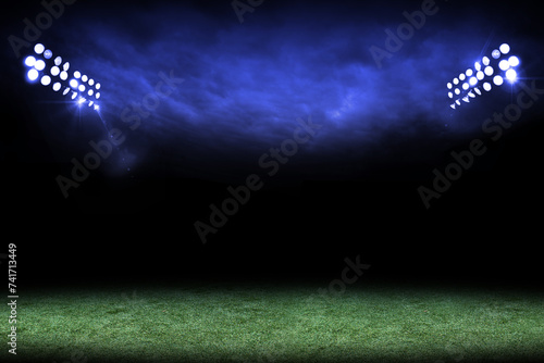 Stadium lights over a grass field