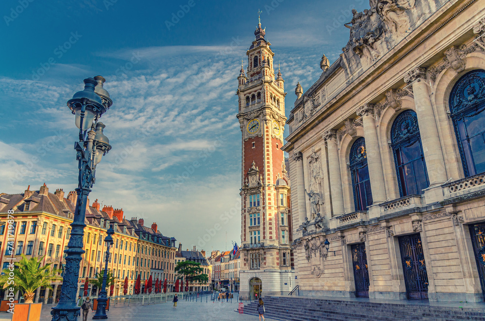 Fototapeta premium Lille Chamber of Commerce Nouvelle Bourse with belfry bell tower, Opera de Lille theatre and street light on Place du Theatre square in Lille city historical center, Nord department, Northern France