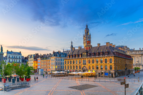 Lille cityscape, La Grand Place square in city center, historical monument Flemish mannerist architecture style buildings, Old Stock Exchange and bell tower Chamber of Commerce, Northern France photo