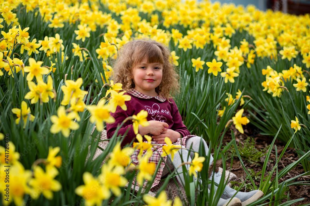 Portrait of a beautiful young girl in dress holding big bouquet Portrait of a beautiful young girl in dress holding big bouquet