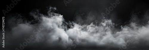 black and white photo showcasing smoke billowing against a black background