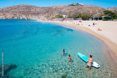 Mikonos, Greece: Agrari Beach with blue sea, wild and quiet, famous for diving, snorkeling and water activity. As most beaches in Mykonos, Agrari Beach is naturism friendly.