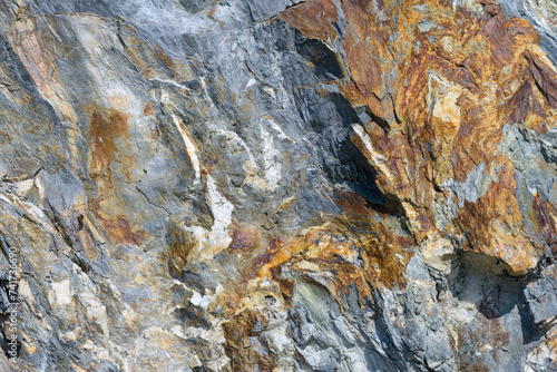 Stone pattern, granite rock surface, colored rock detail texture, rock structures, marble granite deposit.