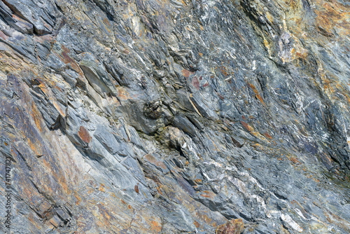 Stone pattern, granite rock surface, colored rock detail texture, rock structures, marble granite deposit.