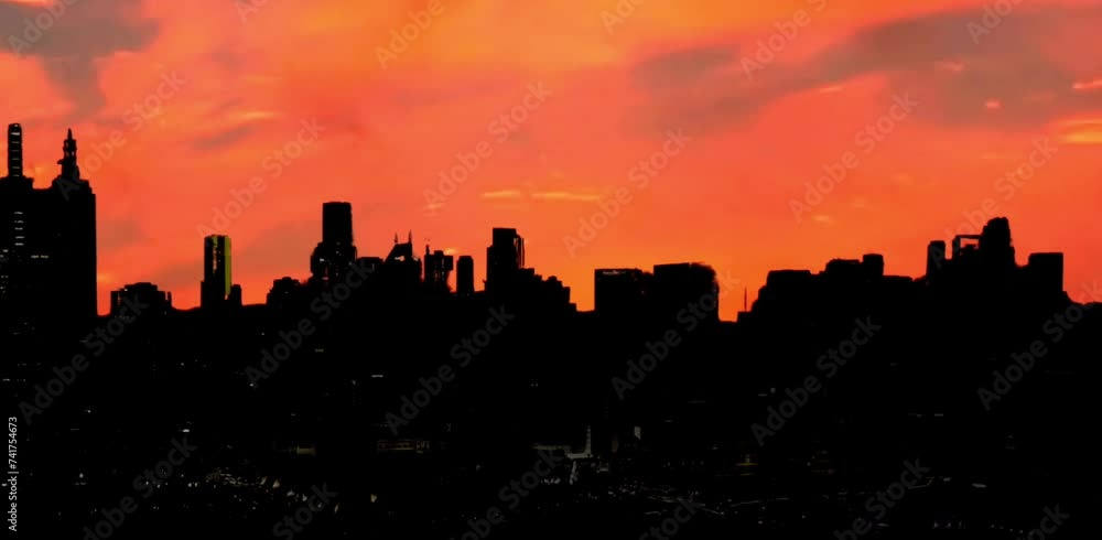 silhouettes of urban high-rise buildings against a bright twilight sky background silhouettes of urban high-rise buildings against a bright twilight sky background