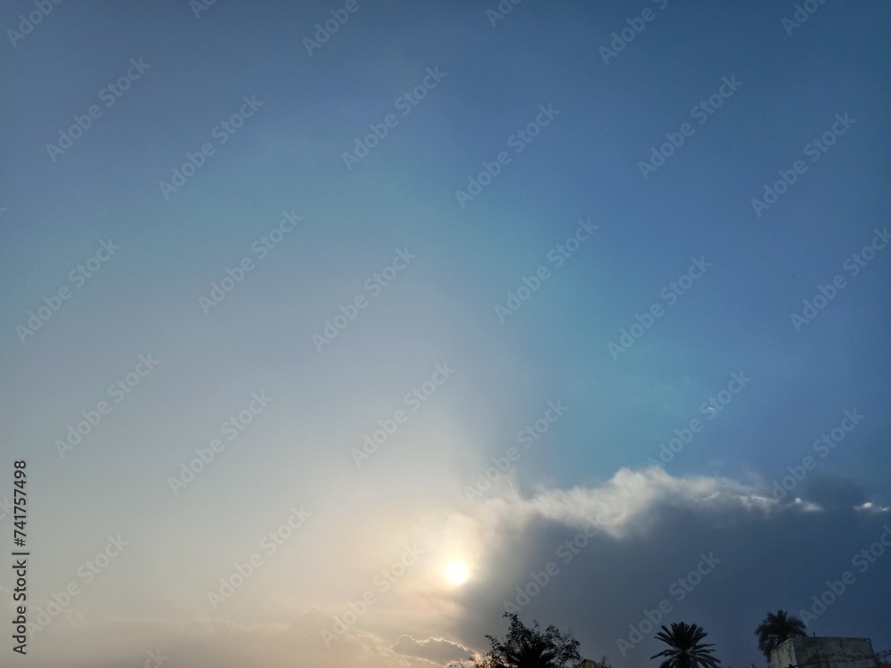 Landscape or sunset with rays and trees and cloudy sky Landscape or sunset with rays and trees and cloudy sky
