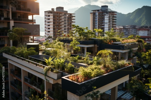 Residential buildings with eco-friendly green rooftops amidst a mountainous backdrop under a clear sky