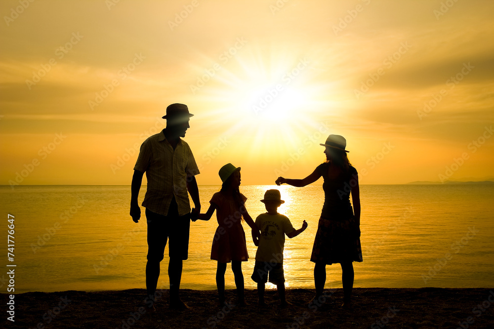 A happy family in nature by the sea on a trip silhouette