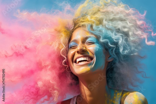 Smiling woman with curly hair enjoying positive emotions at the Holi Festival of Colors