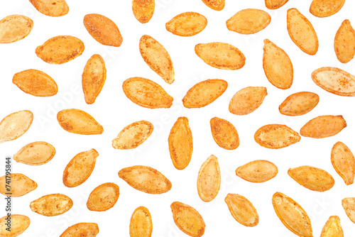 Roasted pumpkin seeds with salt flying, pattern isolated on white, clipping	 photo