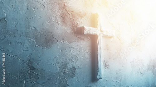 Religious Cross Against a White Textured Background with Rays of Sunlight Hitting the Cross and Creating a Luminous Glow - Spiritual Concept