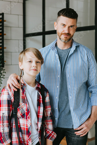family dad young man see off his son teenage cute boy with backpack to school, quality time with your family, education back to school concept