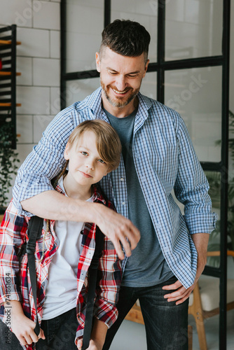 family dad young man see off his son teenage cute boy with backpack to school, quality time with your family, education back to school concept