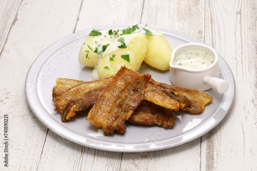 "Stegt flæsk" ( Pork belly with skin sliced and fried, parsley sauce, and boiled potatoes).　Denmark's national food.