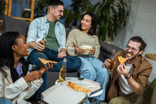 Multiracial group of friends having pizza party.