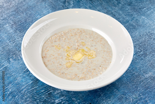 oatmeatl porridge in white plate