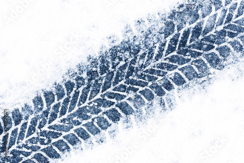 Wallpaper Mural Snow tyre mark. Asphalt covered in snow. Dangerous road conditions. Car imprint on frozen ground. Tire trail on ice. City streets covered in snow during heavy snow fall. Slippery road background. Torontodigital.ca