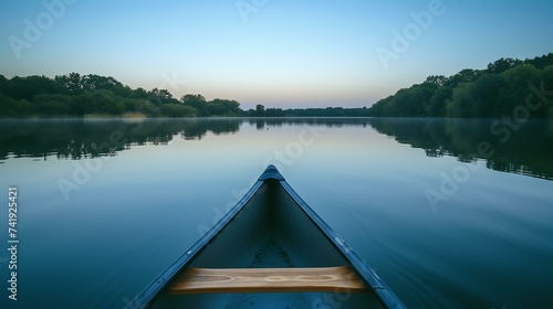 A serene canoe excursion on a serene lake: early morning light bestows a captivating mirror-like effect, inducing pure tranquility.
