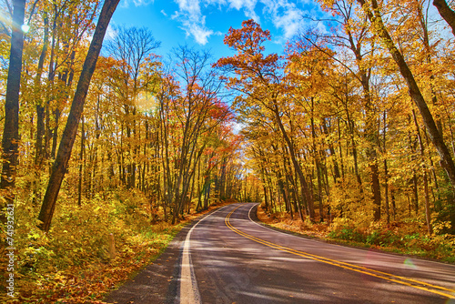 Autumn Splendor on Keweenaw Country Road, Michigan - Golden Foliage and Blue Sky photo