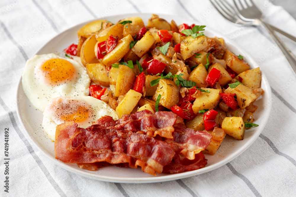 Homemade One-Pan Breakfast Potatoes on a Plate, side view. Homemade One-Pan Breakfast Potatoes on a Plate, side view.