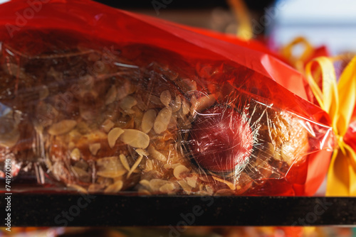 Tsoureki, Traditional Greek Easter Bread, greek freshly baked cake in Athens, Greece, with almond, mastiha, mahleb and cinnamon, orthodox Easter in Greece, sweet bread with red eggs photo