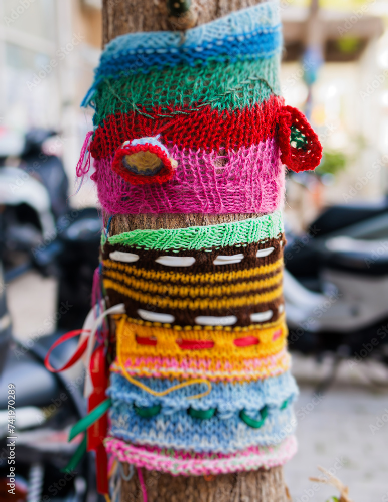Yarnbombing, trees decorated with yarn bombing, knitted graffiti street art, kniffiti in the european city, colored urban knitting, process of graffiti knitting and creating guerilla knitting Yarnbombing, trees decorated with yarn bombing, knitted graffiti street art, kniffiti in the european city, colored urban knitting, process of graffiti knitting and creating guerilla knitting