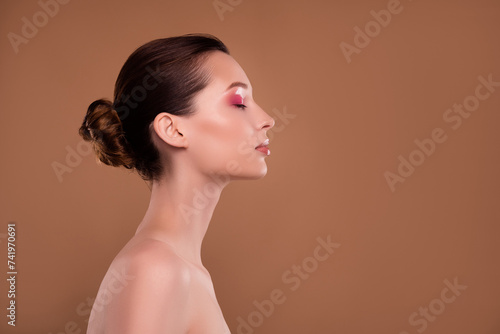 Photo of hot chic girl finish luxurious perfect makeover for vogue event advertise on brown empty space