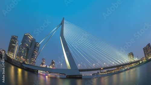 Rotterdam Netherlands time lapse, city skyline day to night at Erasmus Bridge photo