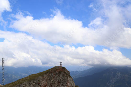 person on the top of the mountain