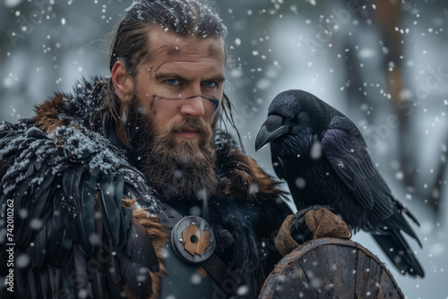 Viking Man in Woods in the Winter with Raven