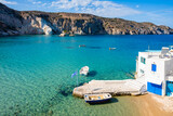 View of beautiful sea bay in Firopotamos village with white houses on shore, Milos island, Cyclades, Greece