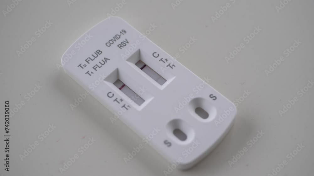 Closeup of an rapid test with positive rsv result Closeup of an rapid test with positive rsv result