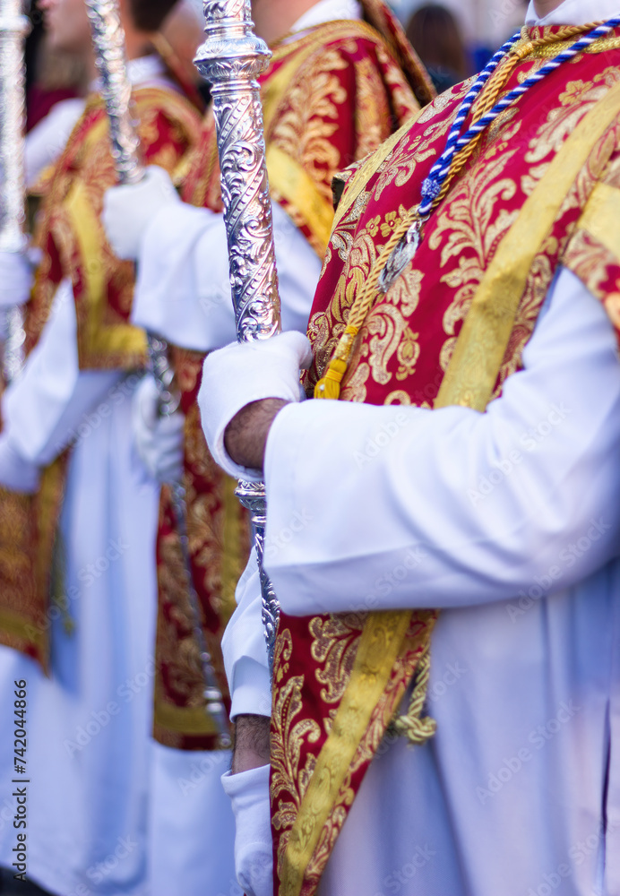 Colorful costumes of the Acolyte Corps in an Andalusian Holy Week procession.