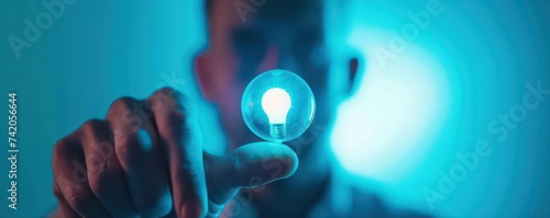 a man holding a blue button on a blue background with a light bulb icon, in the style of multidimensional imagery, futurist mechanical precision