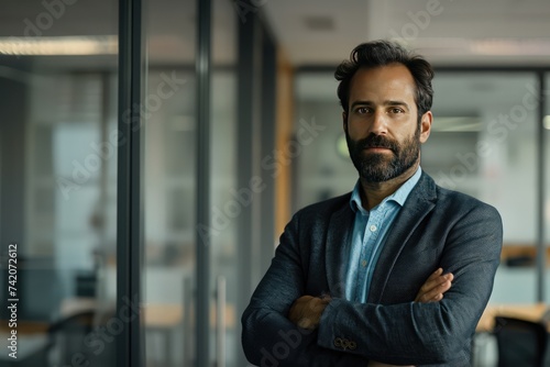 portrait of a businessman standing in an office with his arms crossed, in the style of authentic details, joyful and optimistic, light indigo and dark gray