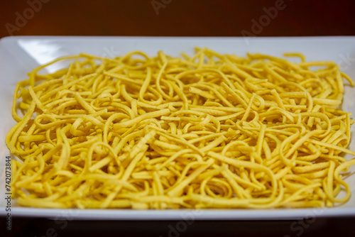 Traditional Spätzle - Spaetzle, a Swabian type of noodle, preparation of food photo