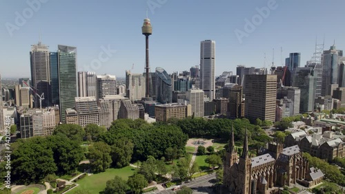 Flying towards Sydney city with Sydney Harbour Bridge Sydney Opera House St Marys Cathedral Hyde Park and Centerpoint tower. photo