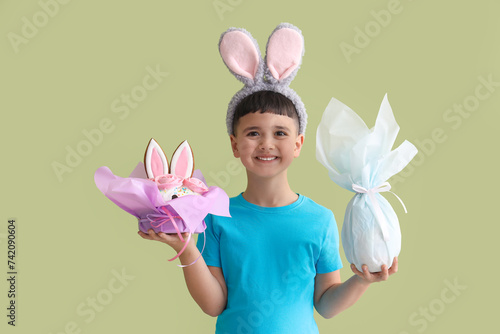 Smiling boy in bunny ears h...