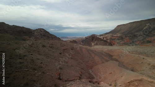 Aerial above dirt road in Kingman Wash Arizona desert by lake Mead
