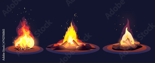 campfire in night forest hiking camping concept